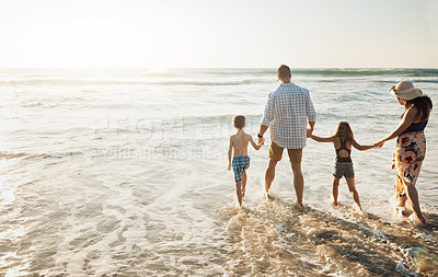 Buy stock photo Family, back view and holding hands with children on ocean coast for walk, summer holiday or bonding together in water. Mother, father or young kids strolling on beach for outdoor vacation or weekend