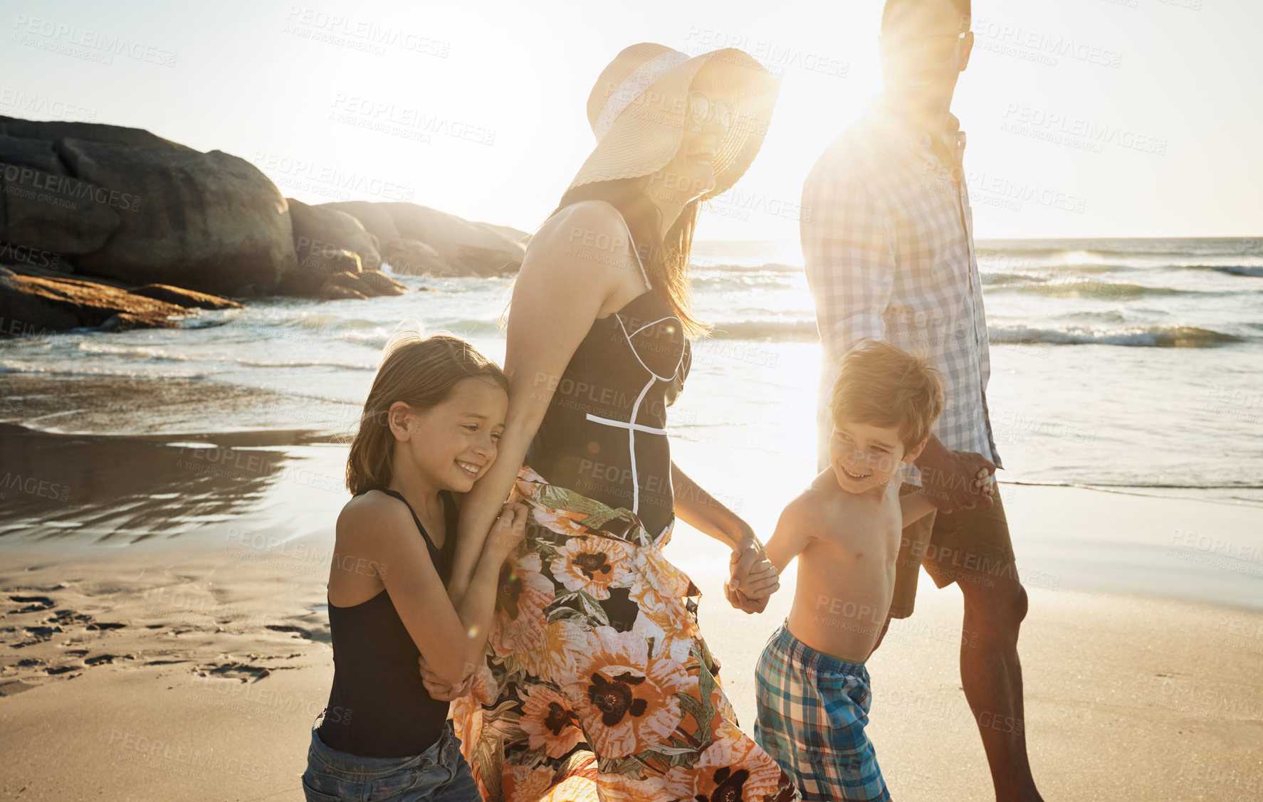 Buy stock photo Beach, family and holding hands on vacation, walking and laughing on coast of Italy for love. Parents, children and happiness together on holiday at sea, ocean and bonding on travel adventure to play