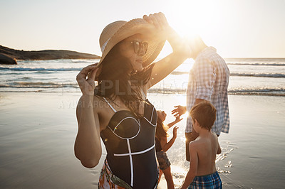 Buy stock photo Shot of a family of four spending the day at the beach