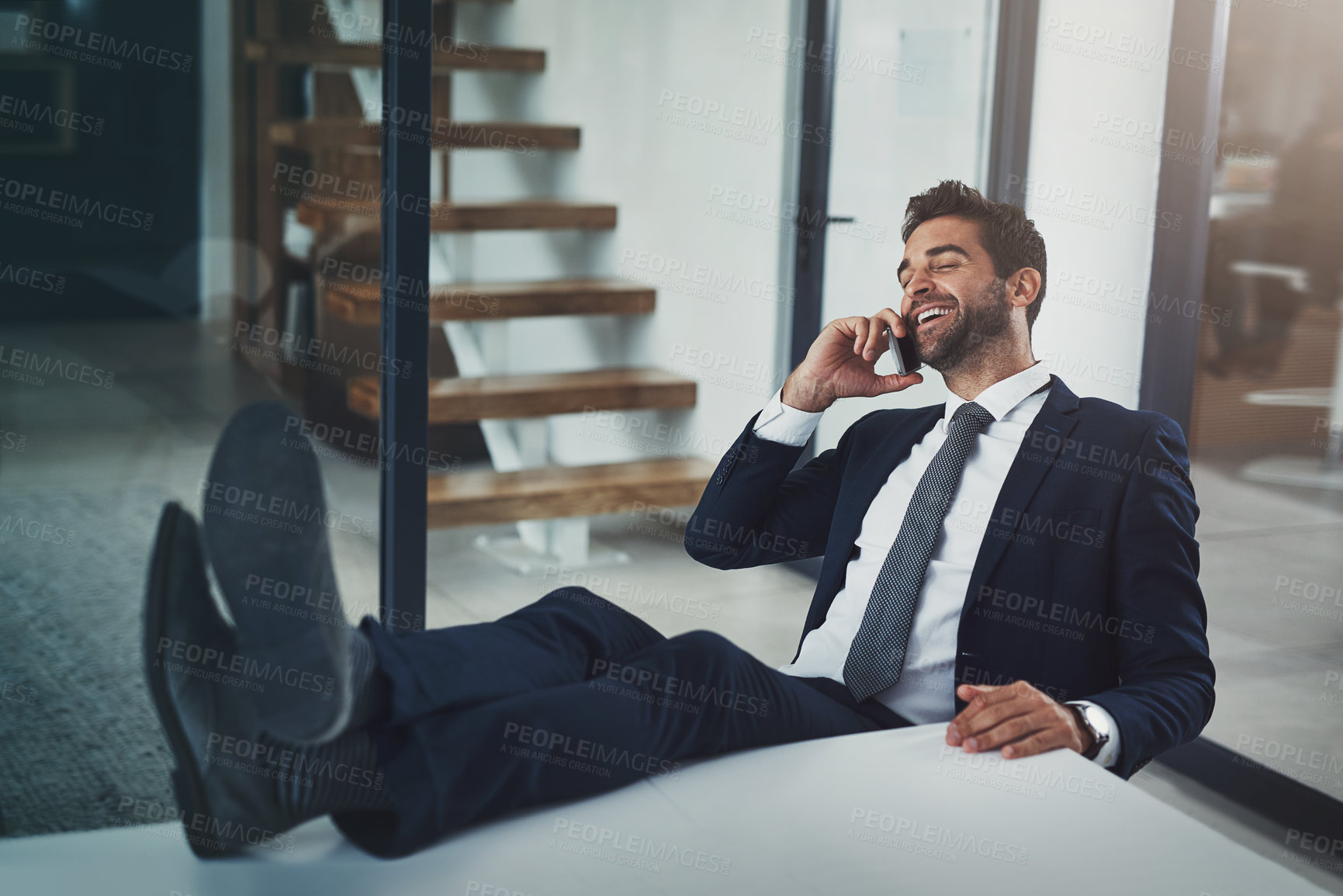 Buy stock photo Phone call, relax and confident business man in office with productivity satisfaction, pride or chat. Smartphone, consulting and entrepreneur with b2b networking, communication or client feedback