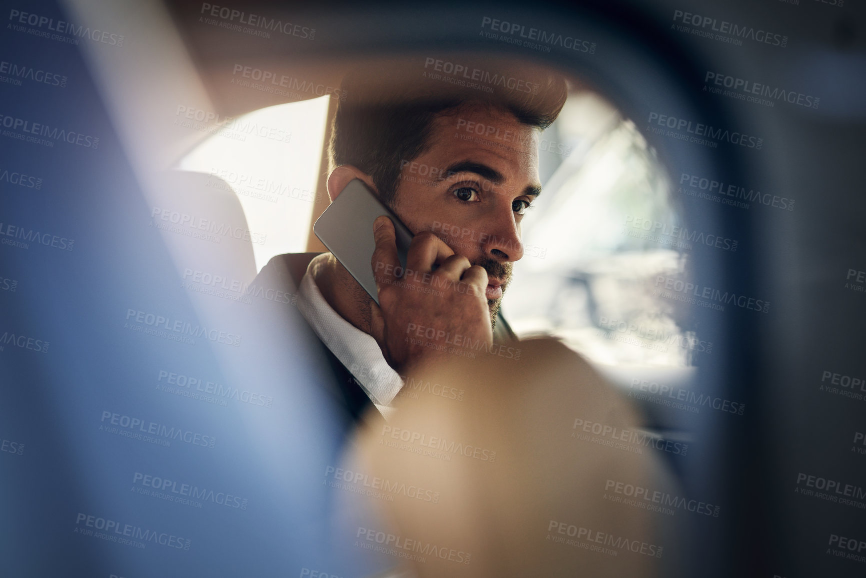 Buy stock photo Car mirror, phone call and businessman in taxi for travel, journey or commute with productivity. Transport, vehicle or entrepreneur in cab backseat with smartphone conversation in chauffeur service