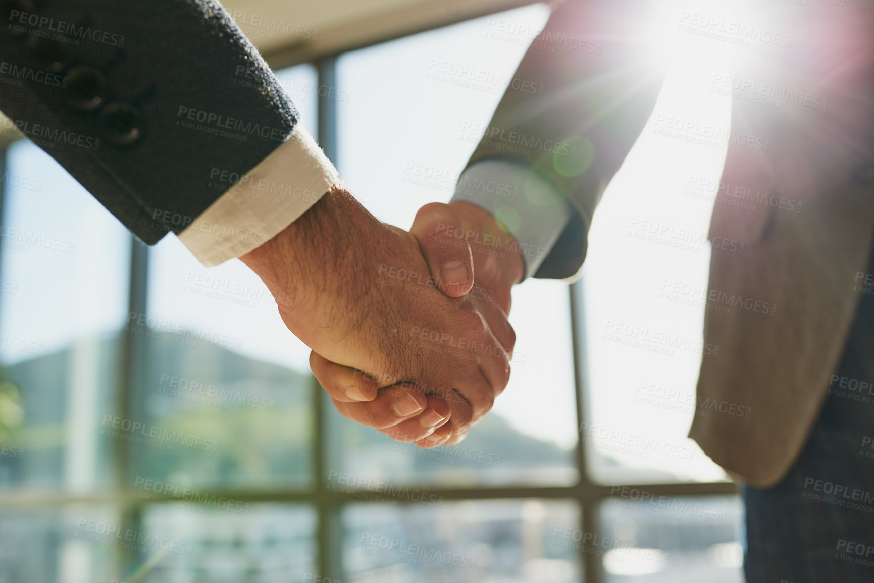 Buy stock photo Full length shot of two unrecognizable businessmen shaking hands in the office