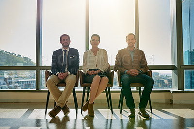 Buy stock photo Full length portrait of a group of businesspeople sitting in line while waiting to be interviewed