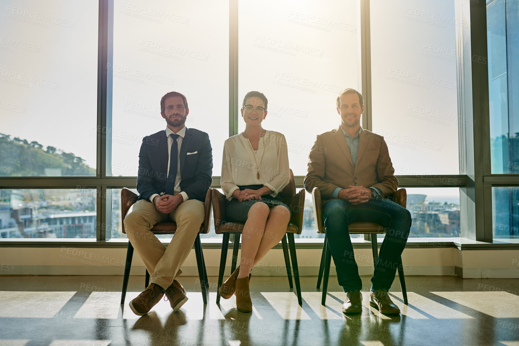 Buy stock photo Full length portrait of a group of businesspeople sitting in line while waiting to be interviewed
