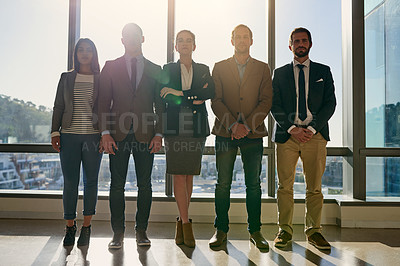 Buy stock photo Full length portrait of a group of businesspeople standing in their office