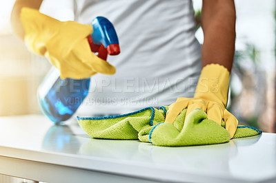 Buy stock photo Shot of an unrecognizable woman cleaning a table at home