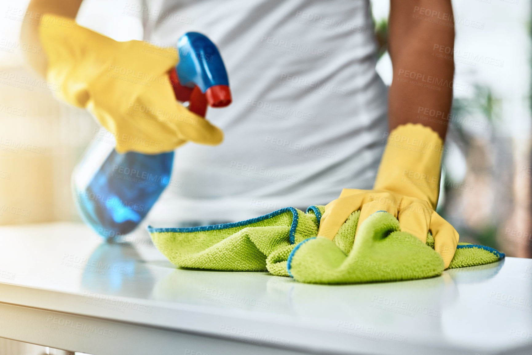 Buy stock photo Woman, hands and spray detergent on kitchen counter for cleaning service, hygiene and safety from germs risk. Cleaner person, maintenance and cloth with chemical liquid, gloves and virus protection