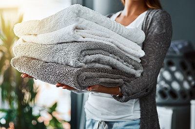 Buy stock photo Laundry, hands and woman with towel stack for spring cleaning linen, fabric and textiles to clean in house work. Person, pile of fresh washing or housekeeping, responsibility or domestic housekeeper