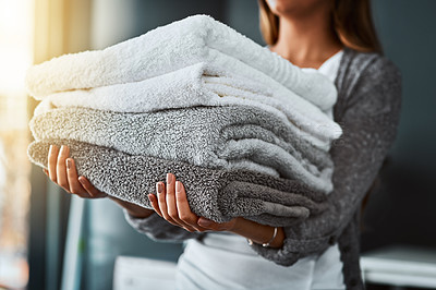 Buy stock photo Laundry, woman and hands with towel stack for spring cleaning linen, fabric and textiles to clean in house work. Person, pile of fresh washing or housekeeping, responsibility or domestic housekeeper