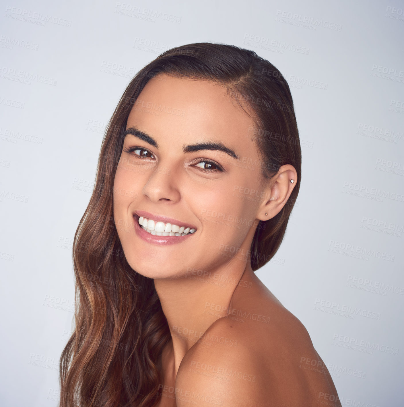 Buy stock photo Studio shot of a beautiful young woman posing against a purple background