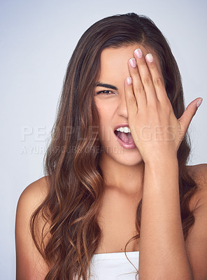 Buy stock photo Portrait, woman and hand in covering eye for face, beauty and pride with confidence for cosmetics. Female person, silly and natural glow on studio background in dermatology, skincare or wellness 