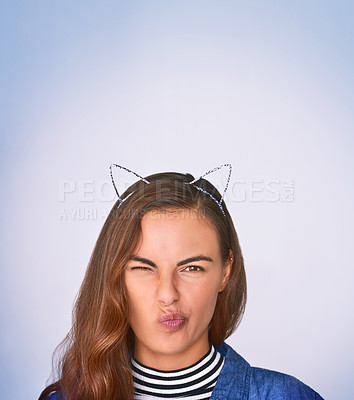 Buy stock photo Cat ears, portrait and wink with woman in studio on gray background for cosplay, costume or fantasy. Expression, face and playful with cute person in animal alice band for fashion or style accessory