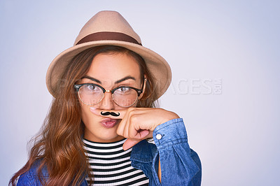 Buy stock photo Woman, portrait and fashion with moustache in studio for funny, comic and funky aesthetic of dress up party. Silly, female person and trendy hat, brand eyewear and pout for event on purple background