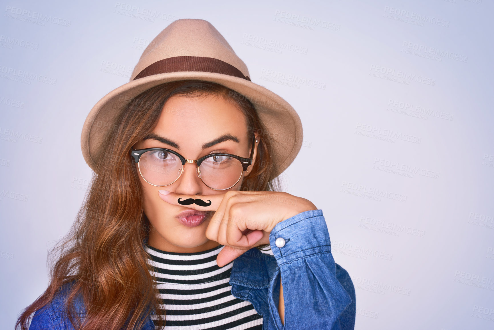 Buy stock photo Woman, portrait and fashion with moustache in studio for funny, comic and funky aesthetic of dress up party. Silly, female person and trendy hat, brand eyewear and pout for event on purple background