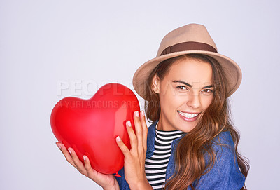 Buy stock photo Studio shot of a beautiful young woman posing against a purple background