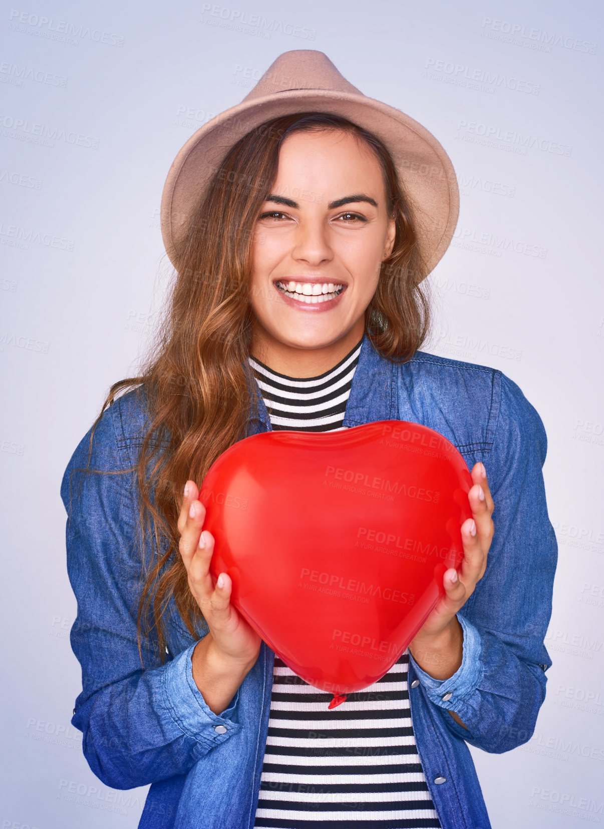 Buy stock photo Woman, happy and heart balloon with portrait in studio for gratitude, romance or symbol of love. Smile, support and female person with inflatable shape by white background for care, emoji or kindness