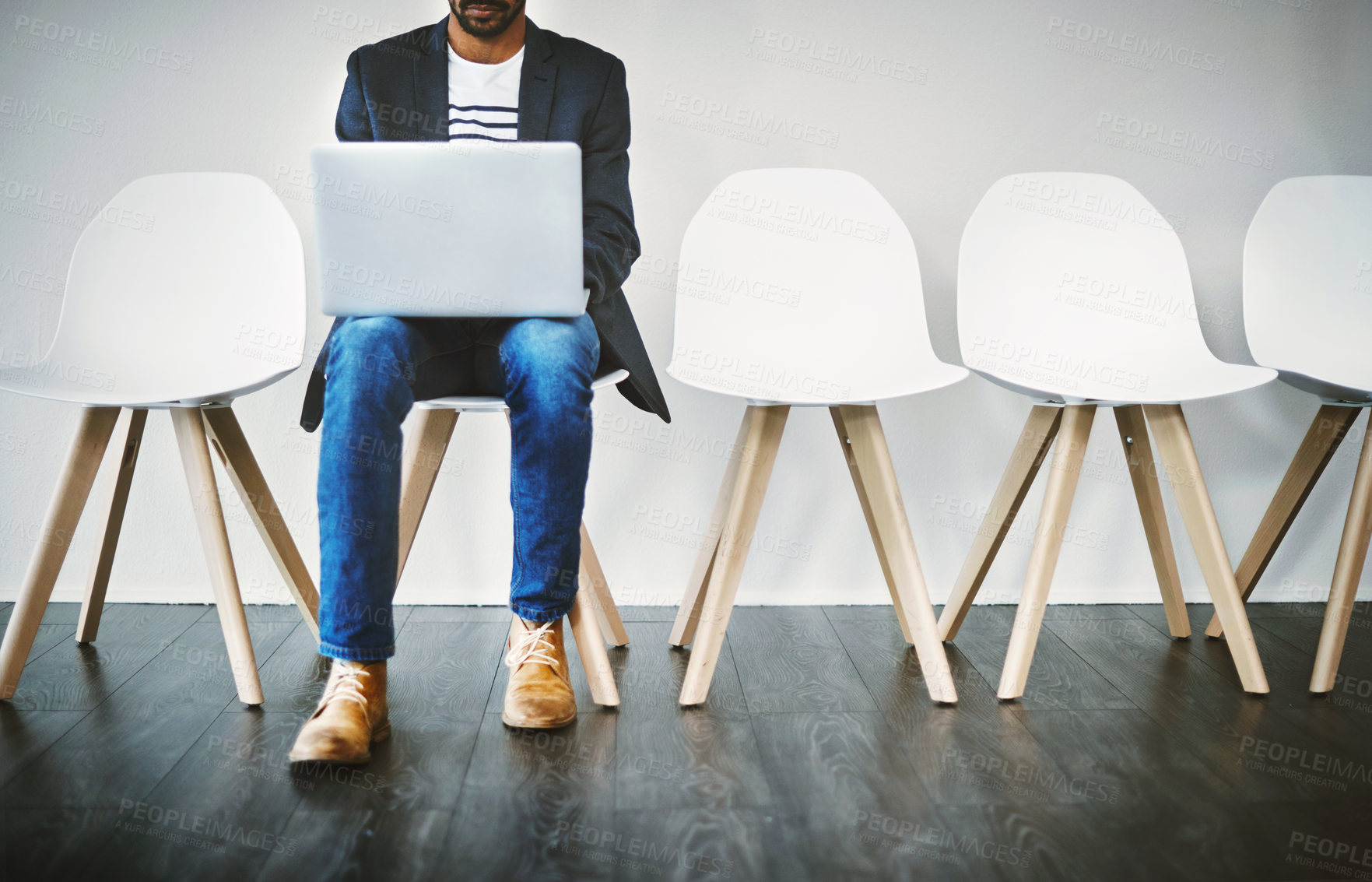 Buy stock photo Waiting room, business person and laptop for recruitment, planning or research questions for hr interview. Wall background, male candidate or digital for information, opportunity or reading portfolio