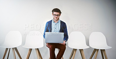 Buy stock photo Waiting room, businessman and laptop for job interview, hiring and research online for hr questions. Chairs, male candidate and digital for information, recruitment and review portfolio for work