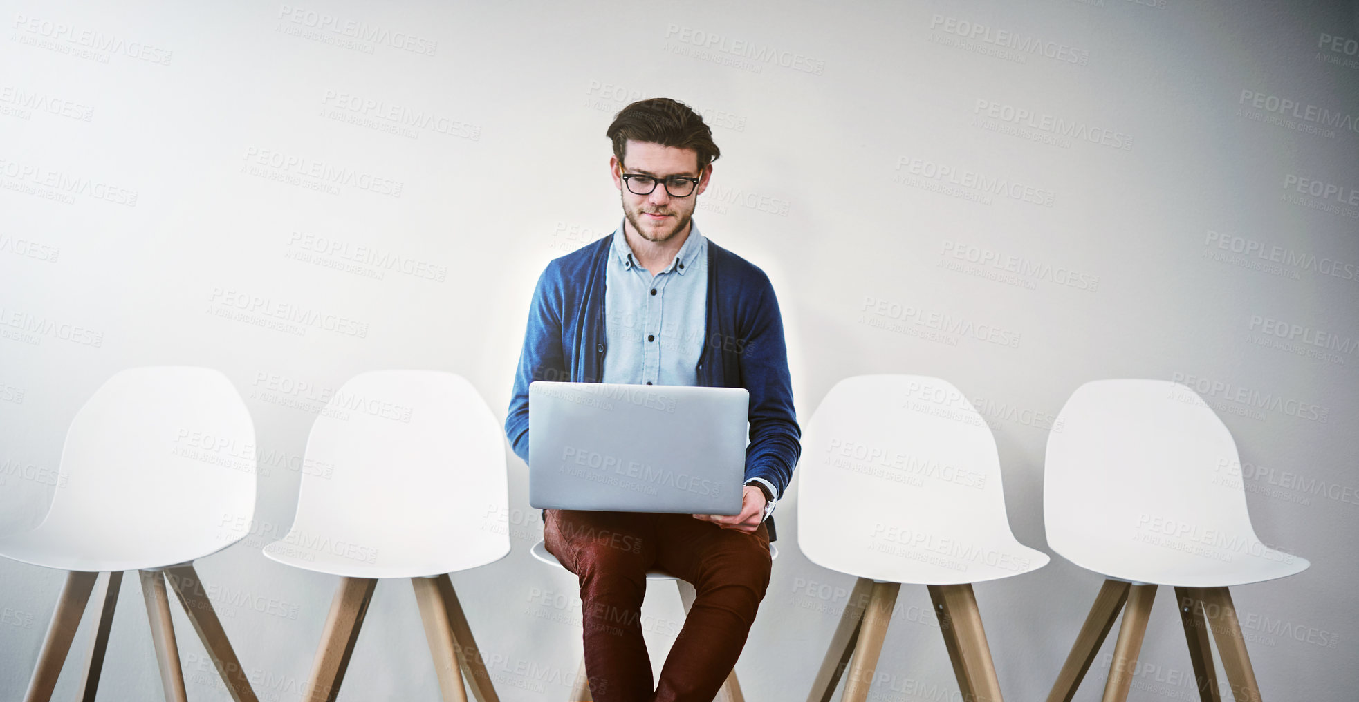 Buy stock photo Waiting room, businessman and laptop for job interview, hiring and research online for hr questions. Chairs, male candidate and digital for information, recruitment and review portfolio for work