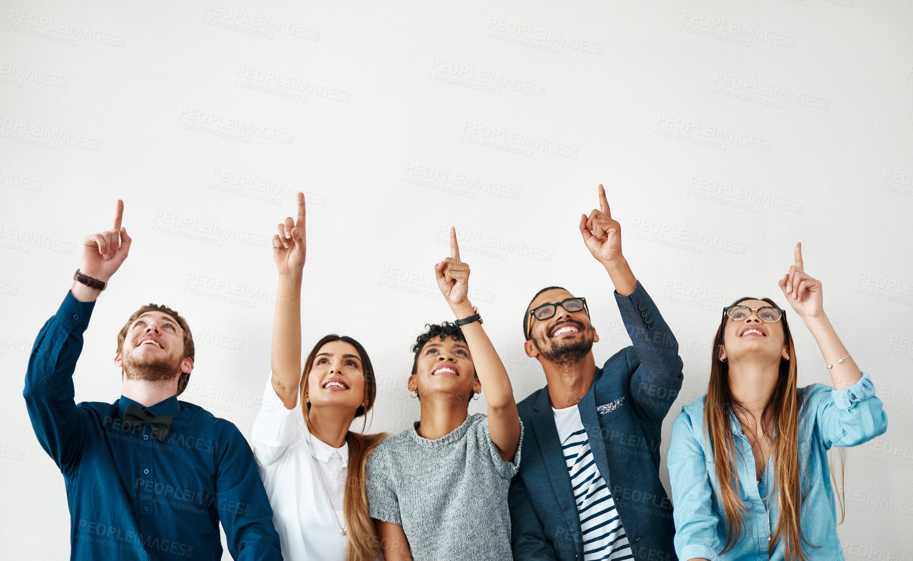 Buy stock photo Business people, smile and group pointing up for mockup, wall and white background space. Creative employees, teamwork and diversity with hand gesture, collaboration and decision for choice approval