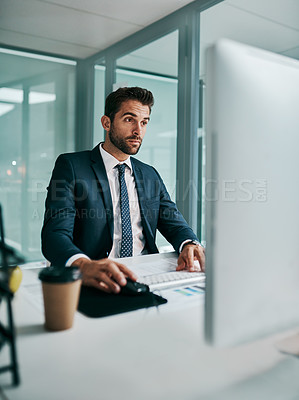 Buy stock photo Business man, reading and planning on computer for research with data analytics, graphs and stats report. Corporate analyst or young accountant on desktop with documents for review of sales or profit