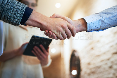 Buy stock photo Closeup shot of unrecognizable businesspeople shaking hands in an office