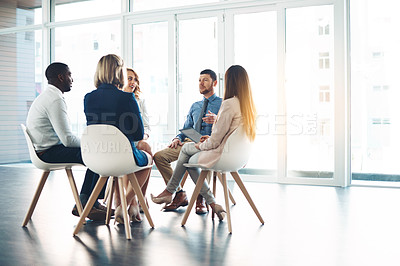 Buy stock photo Full length shot of a group of corporate colleagues meeting in their office