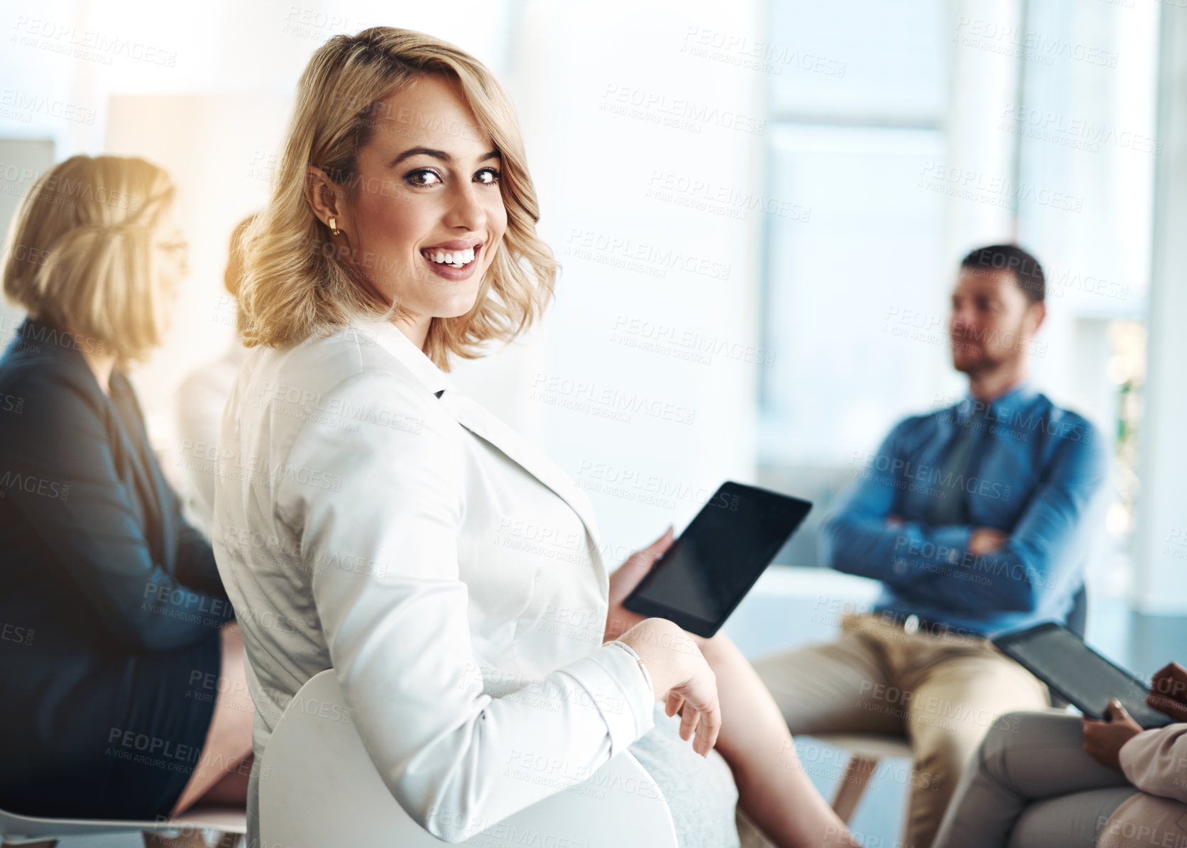 Buy stock photo Cropped portrait of an attractive young businesswoman sitting in the office during a meeting