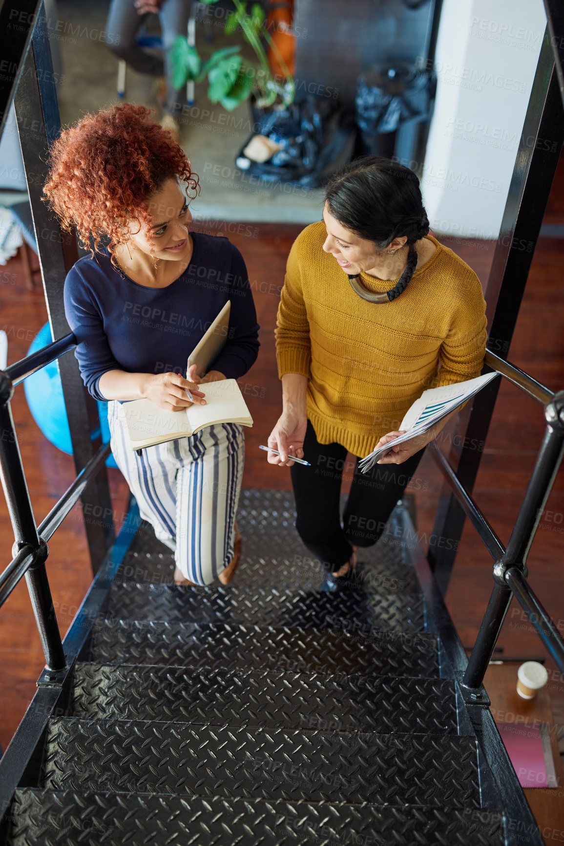 Buy stock photo Shot of two designers discussing something in an office