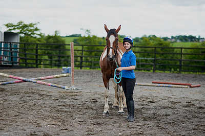 Buy stock photo Girl, horse and portrait in nature for equestrian, development and learning with bonding or connection. Teenager, animal and pet outdoor for riding, care and fitness with smile, exercise and helmet
