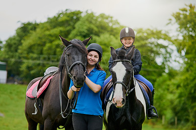 Buy stock photo Girls, horse and portrait outdoor for equestrian, development and learning with bonding or connection. People, siblings and pet in nature for riding, care and fitness with smile, exercise and helmet
