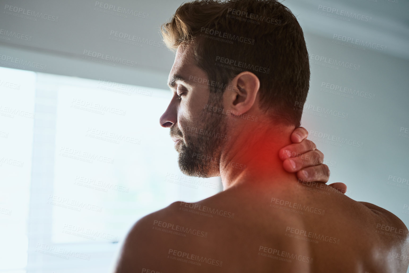 Buy stock photo Home, man and discomfort with neck pain after injury, muscle tension and medical crisis in morning. Topless, male person and inflammation with red glow for bursitis, fibromyalgia and stress in house