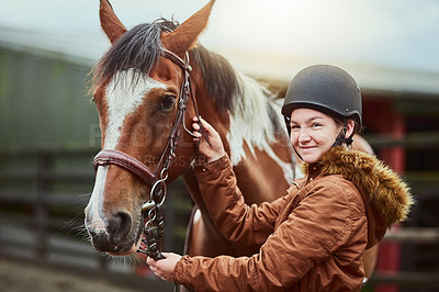 Buy stock photo Horse, portrait and girl prepare bridle at farm for race, sport and training at countryside ranch. Animal, equestrian and adjust reins for riding with pet for safety, care and happy teenager outdoor