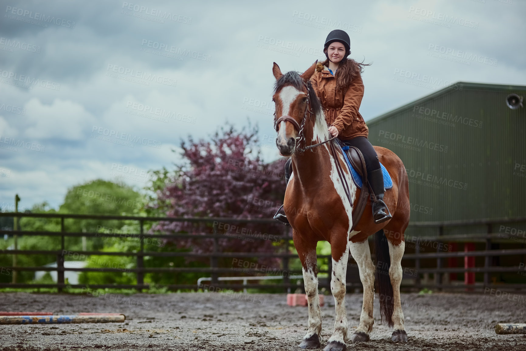 Buy stock photo Portrait, horse and child riding on farm for sport, countryside training and equestrian development. Stallion, girl rider and balance for exercise practise, wellness hobby and ranch outdoor of travel