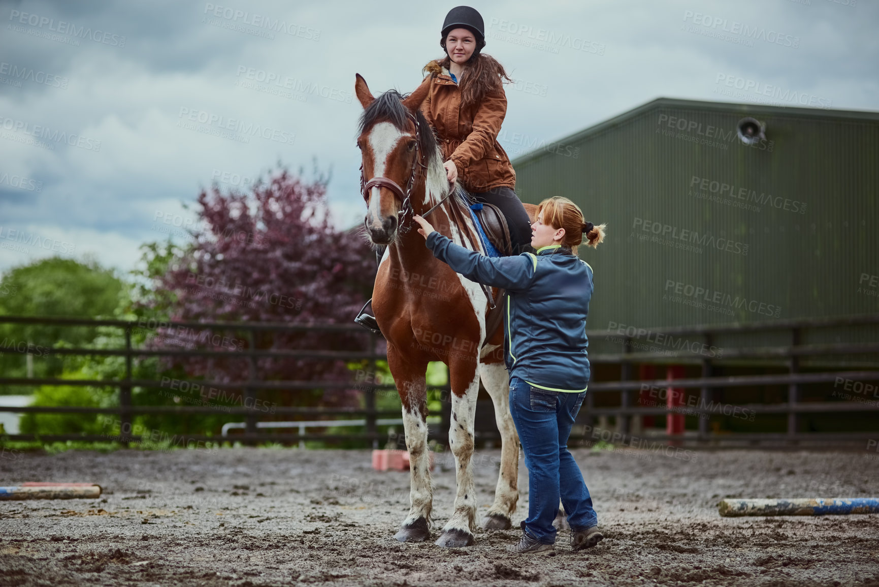 Buy stock photo Horse, child and trainer on farm for riding sport, countryside training and equestrian development. Stallion, girl and woman for balance support, practise advice and ranch hobby for exercise outdoor