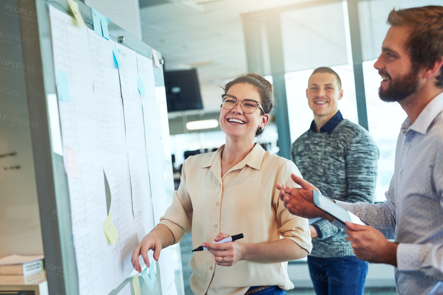 Buy stock photo Shot of a group of businesspeople brainstorming in an office