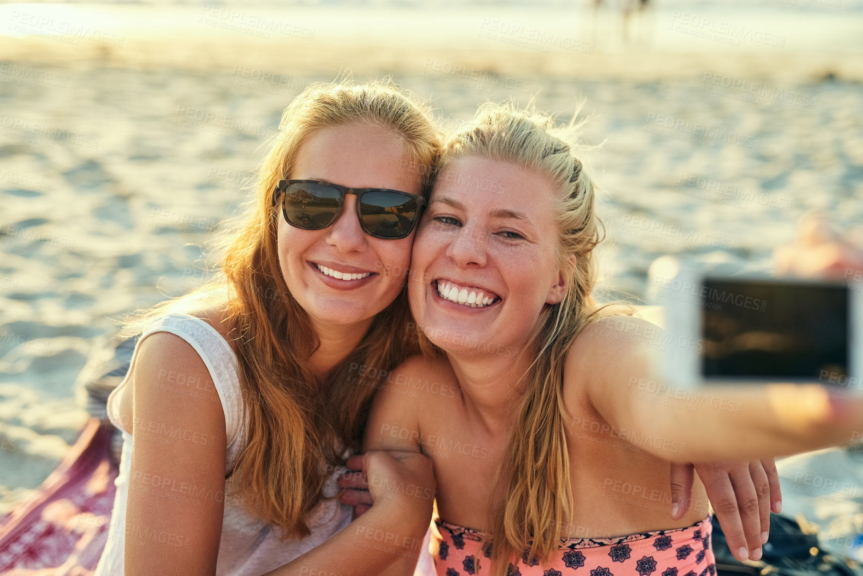 Buy stock photo Happy, lesbian and couple with selfie at beach for summer photography, vacation and social media post. Smile, lgbtq and women with embrace for profile picture update, bonding love and travel together