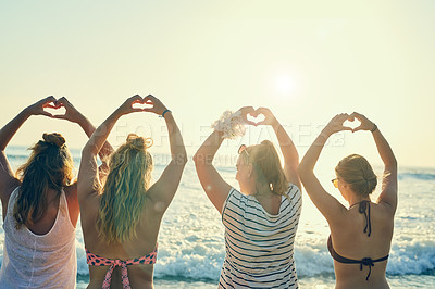 Buy stock photo Back, friends and women with hand hearts at beach for summer vacation, bonding and travel together. People, love gesture and celebration support for reunion hope, tropical horizon and Miami morning