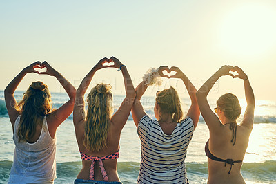 Buy stock photo Back, women and friends with hand heart at beach for summer vacation, bonding and travel together. People, love gesture and celebration support for reunion hope, tropical horizon and Miami morning