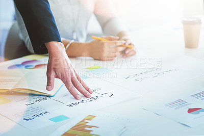 Buy stock photo Cropped shot of unrecognizable businesspeople working together in an office