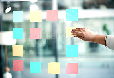 Buy stock photo Business woman planning company growth and strategy by arranging sticky notes and managing her schedule. Closeup of an employee brainstorming ideas for a startup mission or vision