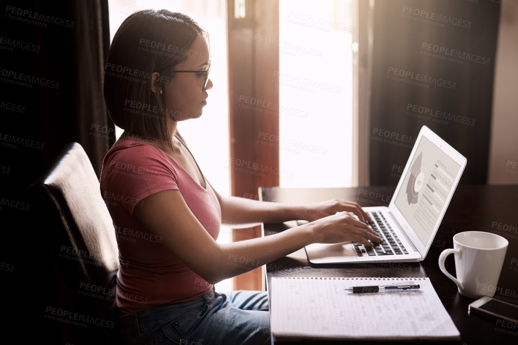 Buy stock photo Cropped shot of an attractive young businesswoman working from home