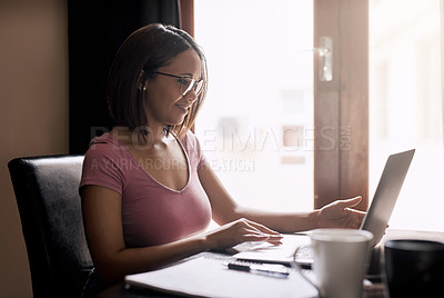 Buy stock photo Cropped shot of an attractive young businesswoman working from home