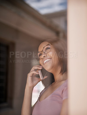 Buy stock photo Cropped shot of an attractive young woman on a call at home