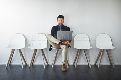 Buy stock photo Studio shot of a businessman waiting in line against a white background
