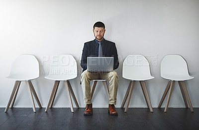 Buy stock photo Studio shot of a businessman waiting in line against a white background