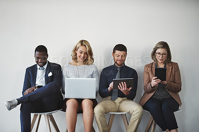 Buy stock photo Business people, technology and diversity in waiting room for interview, meeting or recruitment on chair. Hiring, human resources and candidate in office for job opportunity, onboarding or employment