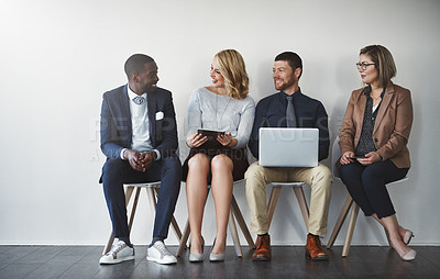 Buy stock photo Studio shot of businesspeople waiting in line against a white background