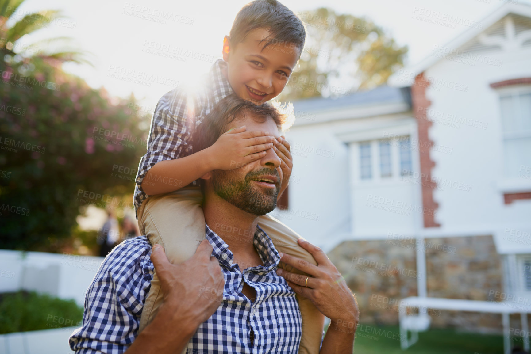 Buy stock photo Carry, father and son with hands on eyes in backyard on home for fun game, guide and walking with trust. Happy family, portrait and people in garden of house with bonding, playing and hiding face