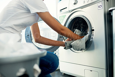 Buy stock photo Closeup, cleaning and woman with laundry, machine and home with clothes, fabric and housekeeping. Zoom, female person and cleaner washing items, housework and laundromat with routine and service